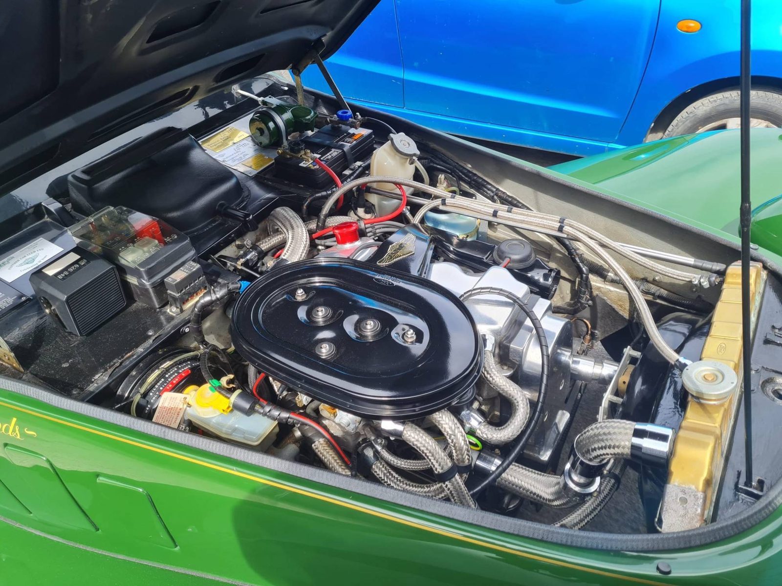 Detailed engine bay of a classic green car