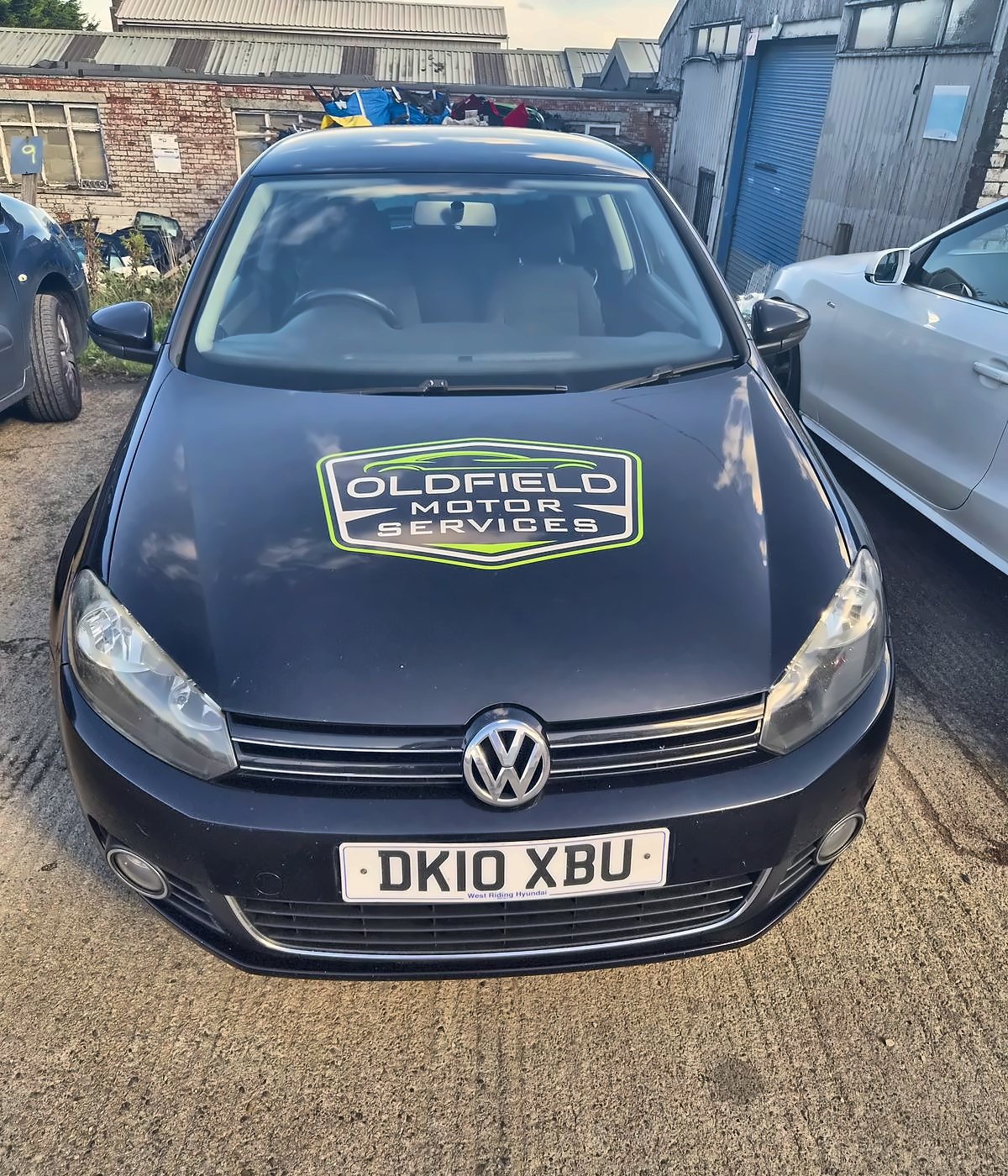 The Oldfield courtesy car, a black VW Golf with the Oldfield Motor Services logo on the bonnet