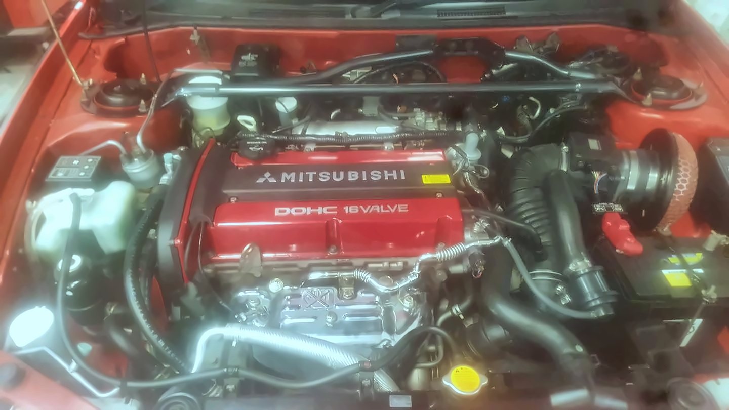 Mitsubishi engine bay with red cam cover